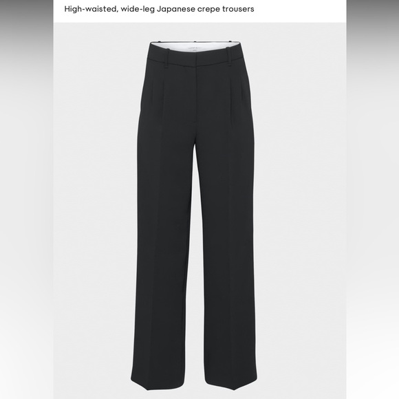 Tailored, relaxed high-rise pants with front pleats and a long, wide leg. - Picture 1 of 5